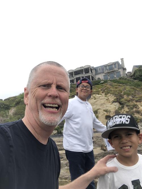 3 people on a hill
