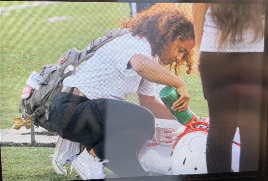 This picture is me helping a football player 